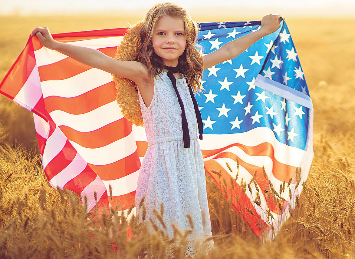 Girl holding US flag