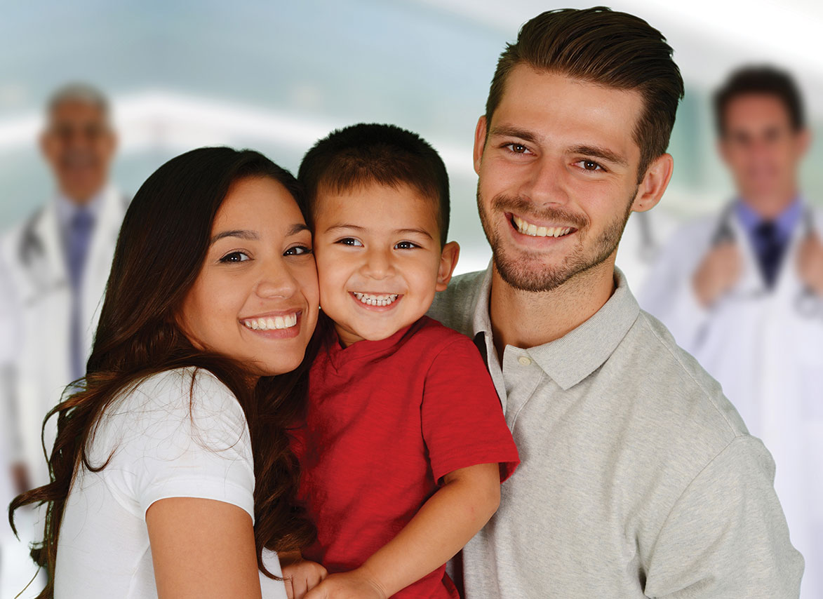 Happy Family with doctors in background