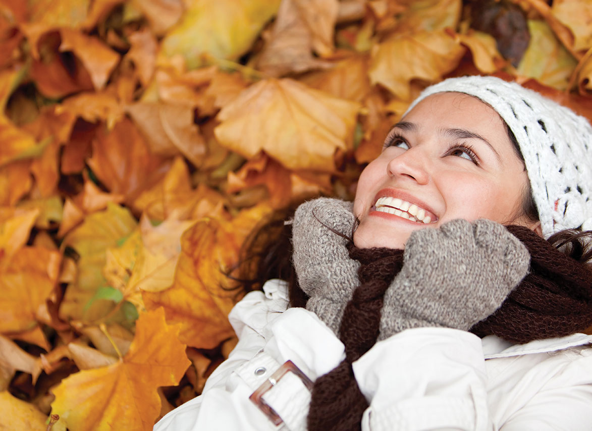 Happy person in Fall Leaves